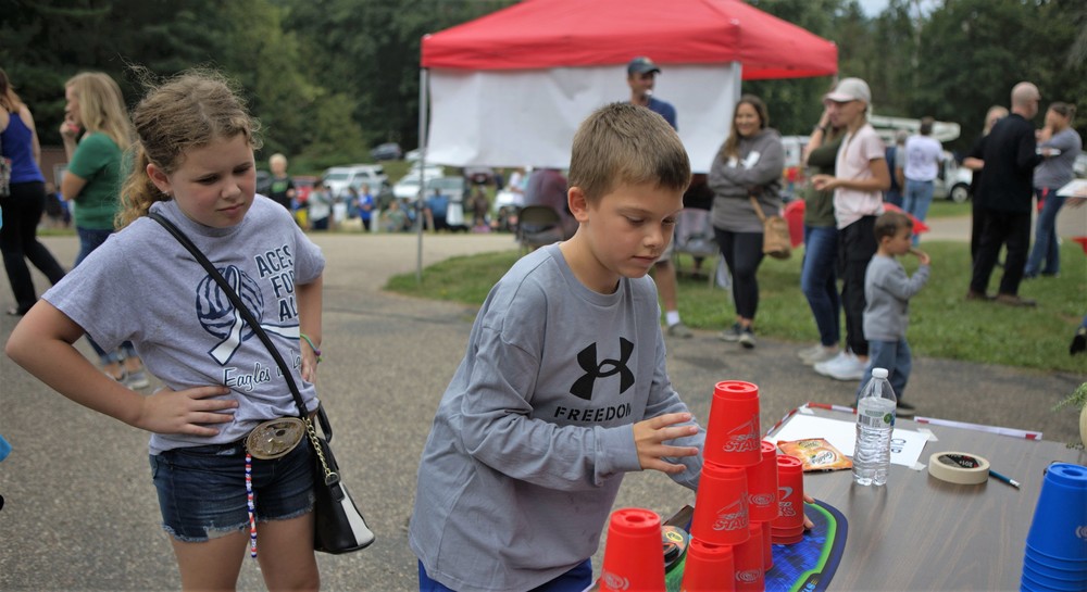 Young community members enjoy playing games at the community fest